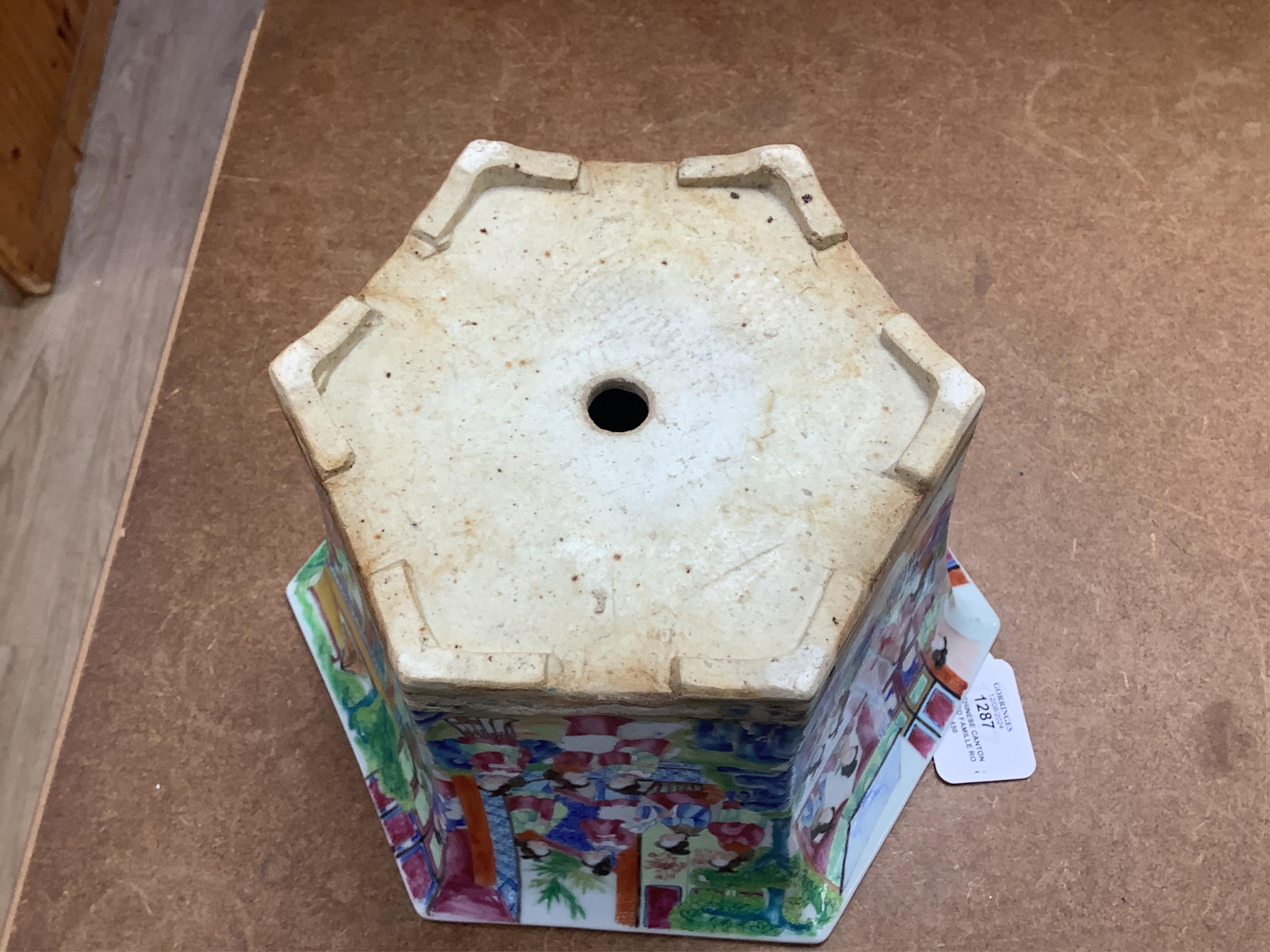 A 19th Chinese Canton decorated famille rose hexagonal planter, with stand, the stand cracked, 19.5cm total. Condition - fair